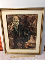 Full view of the framed original mixed media artwork depicting a seated figure by Lin Serebrin showing the colors, texture, size with ruler below for scale.