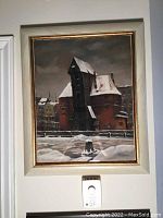Framed original charcoal and pastel artwork showing winter cityscape, highlighting the entire piece and frame.