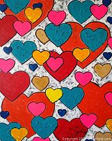Close-up view of multicolored heart shapes and paint texture