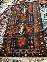 Overall view of rug showing central field pattern and border