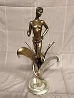 Front view showing figure and lily base