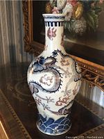 Angled front view showing full vase profile and dragon decoration.