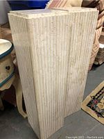 Single column showing overall height, fluted sides and square top