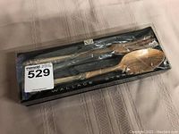 Both salad servers sealed in original presentation box