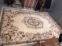 Overhead view of entire wool area rug laid flat on floor