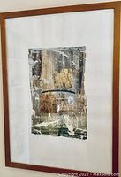 Full view of framed abstract mixed media artwork with wooden frame and white matting showing textured layers in neutral colors.
