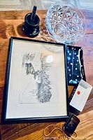 Photo shows all items in lot including crystal glass bowl, marble mortar and pestle set, trays, container, purse, and one framed art print with waterfront scene.