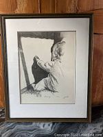 Full view of the framed print showing the child reaching towards their shadow on a wall, titled 'Discovery' signed by Zeltner.