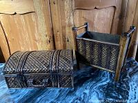 Both items together, showing the magazine rack and curved top woven storage case on a cloth surface.