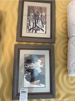 Two framed art prints by Bev Dolittle with nature themes, shown side by side on a beige surface.