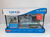 Front view of unopened Top Fin 5 Gallon Aquarium Starter Kit box showing all components through clear plastic window.