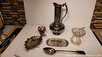 Full set photo showing all included items: pitcher, sugar bowl, ladle, trays, and baskets.
