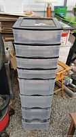 Front view of the 8 drawer plastic organizer showing all eight transparent drawers with black frame.