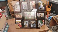 Photo collage frame with 11 photo slots, new with corner cardboard protectors and clear wrapping visible.