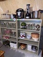 Angled photo showing jars and some kitchen appliances on shelves to illustrate shelving size.