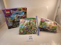 Lot displaying three LEGO Friends sets including one boxed (41036) and two in plastic bags with manuals.