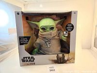 Front view of unopened Star Wars The Mandalorian The Child figure in original box showing detailed figure and packaging.