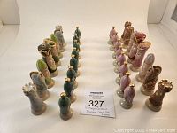 Full set of 32 vintage Duncan Mold ceramic chess pieces arranged in two rows by color.