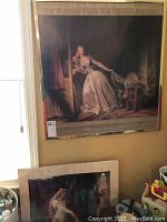 Photo showing two Renaissance themed posters, one hung on a wall and another leaning against the wall.