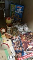 Full lot with musical chickenhawk figure, signed baseballs, brass baseball and glove trophy, 1992 and 1993 World Series Blue Jays scorebooks, magazines, mugs, and cereal box