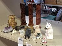 Front view of all figurines and incense holders on table