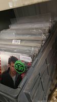 Bin of vinyl LPs in plastic sleeves showing Corey Hart album cover with price sticker