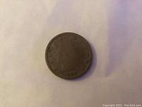 Obverse side of 1908 Liberty Head nickel coin showing Liberty Head and date 1908