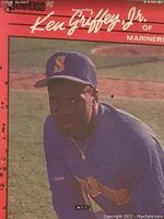 Front view of Ken Griffey Jr rookie card showing player in Mariners uniform with red border and player name.