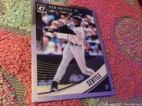 Front of the Ken Griffey Jr baseball card showing player in batting position, card belongs to Donruss Optic 2018 series, Seattle Mariners team info visible.