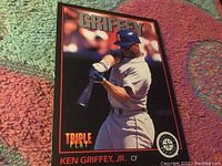 Front of the Ken Griffey Jr rookie baseball card #1 showing the player in batting stance for Seattle Mariners with Triple Play branding.