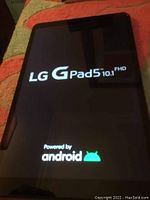 Tablet screen showing 'LG G Pad5 10.1 FHD Powered by android' startup screen