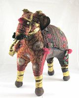 Front and side view of colorful hand embroidered stuffed fabric elephant with gold and wool decorations showing detailed craftsmanship and condition.