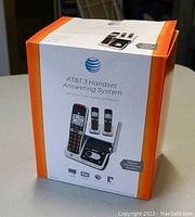 Box of AT&T 3 handset answering telephone system with image and branding