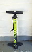 Full view of yellow and black Bell Air 655 bicycle pump with handle, foot pedals, and main air chamber