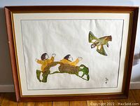 Framed stone-cut print showing the full artwork and frame on a wood floor.