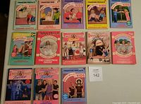 Overview of 13 Sweet Valley Kids and Twins novels laid out on a surface, showing colorful illustrated covers with children and teen characters in various scenes.