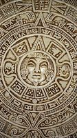 Close-up photo of the center face and detailed engravings of the Aztec Sun Calendar ceramic wall hanging.