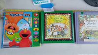 Sesame Street Opposite Day, Mother Goose Rhymes, and Beatrix Potter Treasury books shown side by side