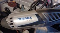 Close-up of Dremel 4000 rotary tool showing branding and tool body.
