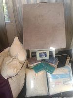 Soft velour backrest cushion with four fiber-filled pillows and pillowcases arranged below, including hypoallergenic pillows by JUSThome