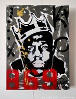 Front view of the painting showing the black and white portrait of The Notorious B.I.G. wearing a crown, with red '859' numbers and gold paint drips on a gray background.