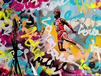 Close-up of stenciled Michael Jordan figure with surrounding spray-paint tags and color drips