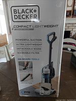 Box front panel showing Black+Decker vacuum model features like powerful suction, ultra lightweight design, detachable wand, washable filter, and onboard tools.