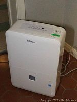 Front view of the Danby Premiere dehumidifier showing the white body and model branding.