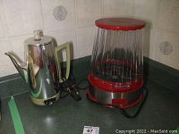 Photo showing both the popcorn maker and percolator coffee pot side by side on a kitchen counter.