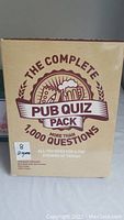 Box of The Complete Pub Quiz Pack with over 1,000 questions for trivia nights