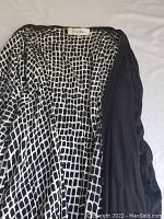 Top black and white geometric patterned Calvin Klein top inside label visible