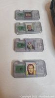 Four Star Wars CommTech character cartridges with chip and character images on casing, laid in a row on white surface.
