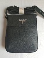 Photo showing the black leather Tahari crossbody bag with tags, highlighting the textured leather, front flap, silver-tone Tahari logo and attached adjustable strap.