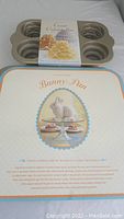 Easter Bunny shaped cake pan and tiered cakelet pan with packaging showing front details of Easter Bunny design.
